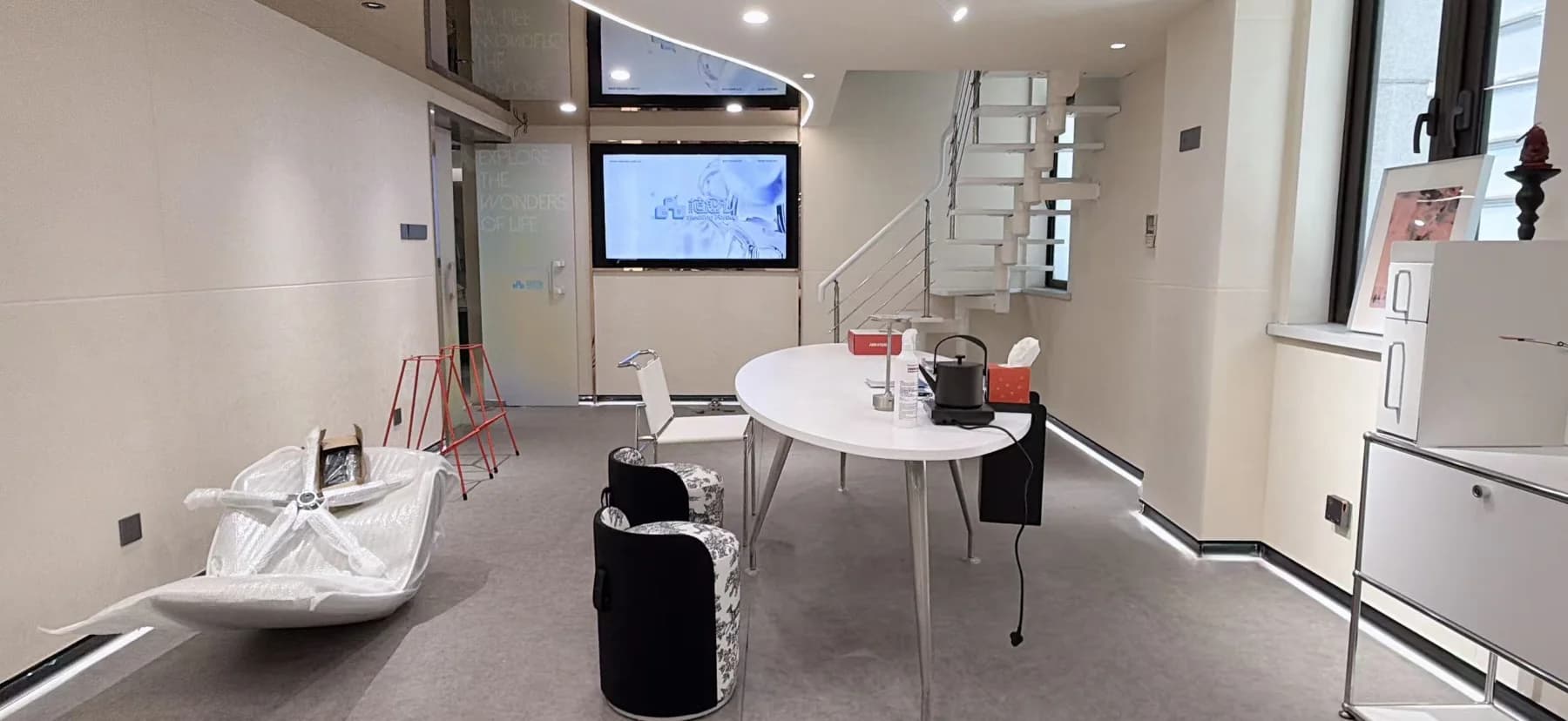 Shanghai experience venue reception suite with consultation table and display screens